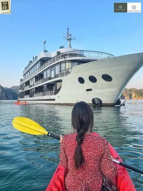 Kayaking alongside Dora Cruise
