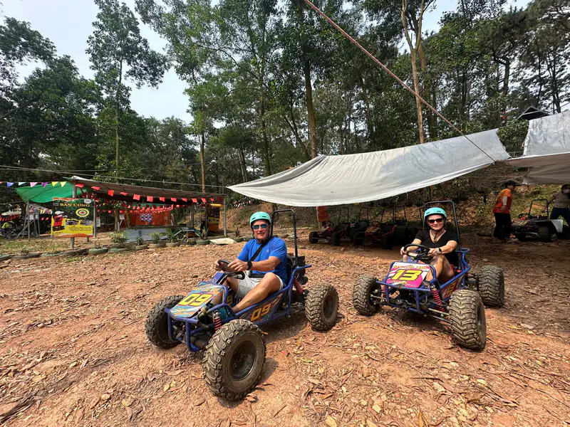Rider on an off-road ATV on a dirt trail