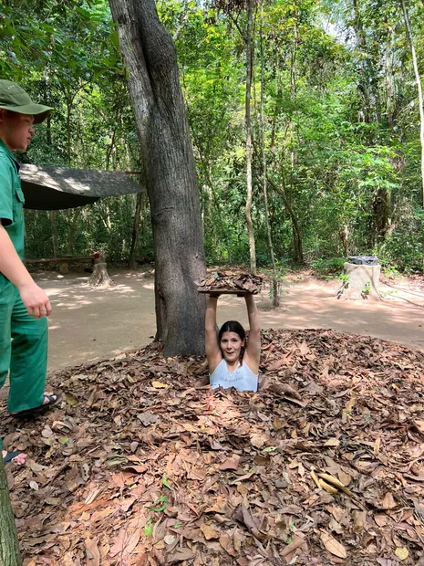 Popping up from a camouflaged tunnel hatch at Củ Chi