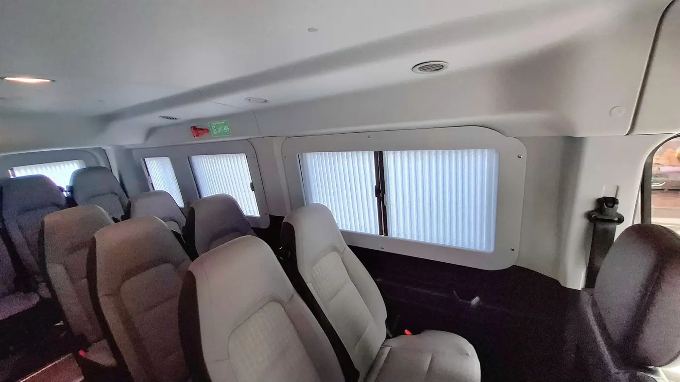 Seat rows running the length of the van