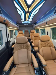 The limousine cabin: tan quilted leather captain chairs under a lit star ceiling