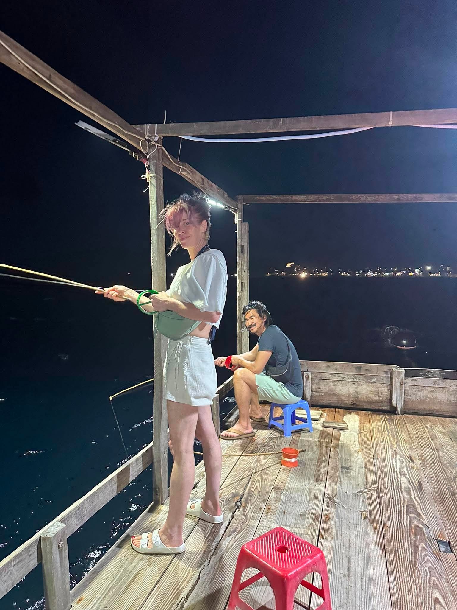 Guest reeling in a squid line